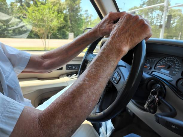 istock Transportation.  Man driving vehicle on spring day. 1397969257