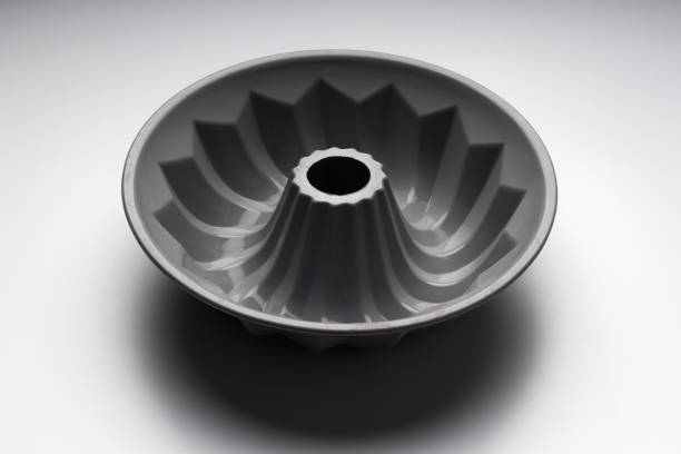 Gray silicone cupcake baking pan on white background, selective focus