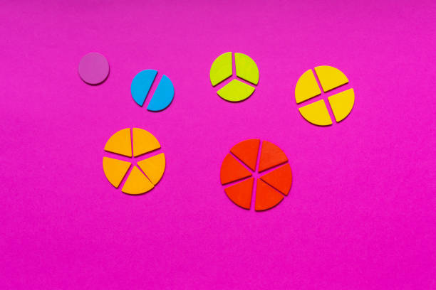 istock Multicolored fractions, rulers, pencils on a magenta pink background. Interesting, fun math for kids. Education, back to school concept 1397970746