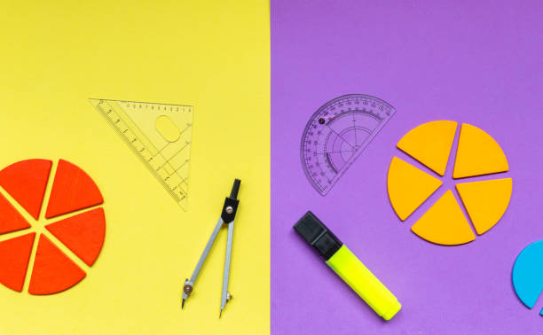 istock Multicolored fractions, rulers, pencils on a yellow violet background. Interesting, fun math for kids. Education, back to school concept 1397970976