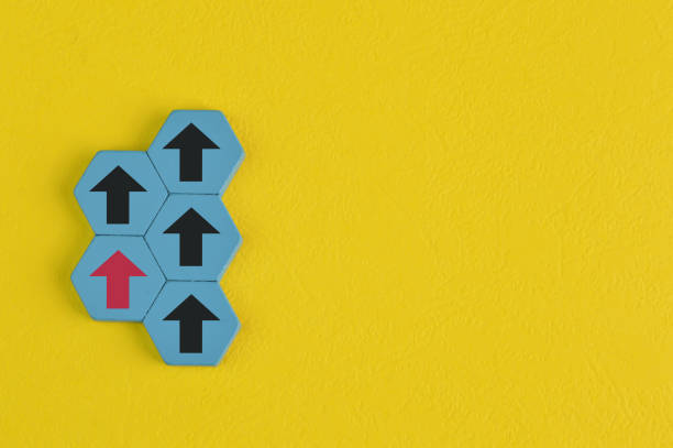 istock Wooden block with red arrow facing the same direction. Copy space 1397970984