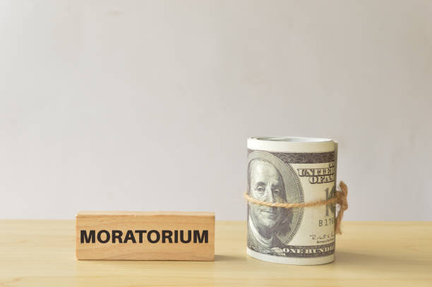 istock Money banknote with text MORATORIUM. Financial relief concept. 1397973324