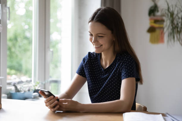 istock Young woman using smartphone enjoy distant communication with friends 1397975011