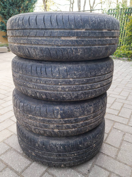 istock Four used car summer tires with wheels stacked. 1397982269