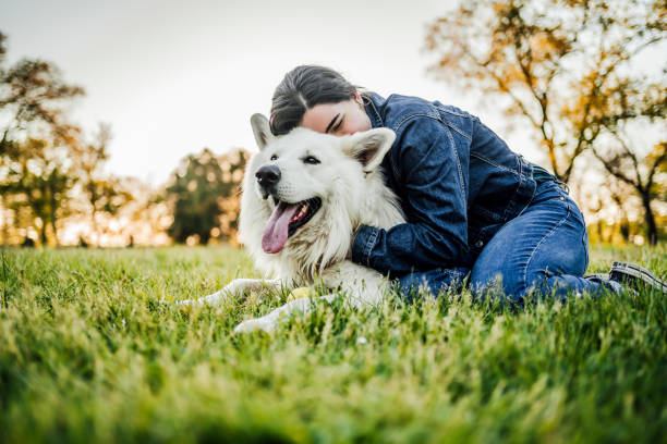 istock Woman enjoying with her dog 1397988063