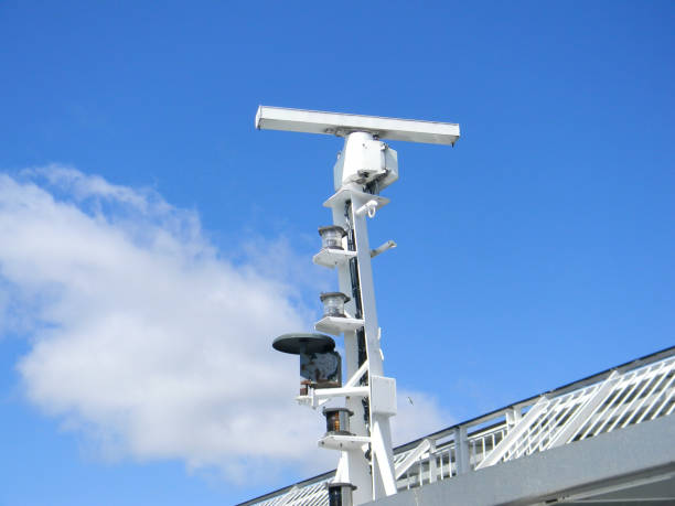 closeup of a marine radar against a bright blue sky - sea safety antenna radar imagens e fotografias de stock