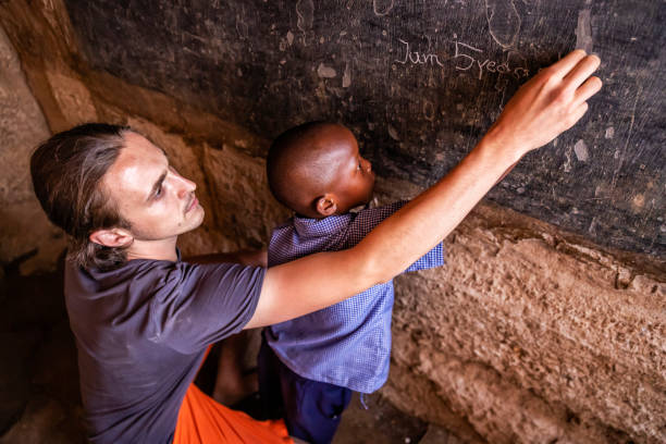 istock Volunteer Teaching in Africa, orphanage in Kenya 1397989482