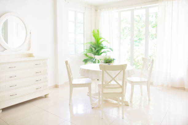 Home interior. Dinning room. Table and chairs. Home interior. Dining room design. Table and chairs in white sunny house. Kitchen breakfast area in family apartment. breakfast room stock pictures, royalty-free photos & images