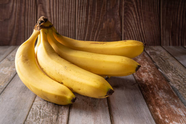 istock Bananas photographed over rustic wood, selective fotus. 1397992116