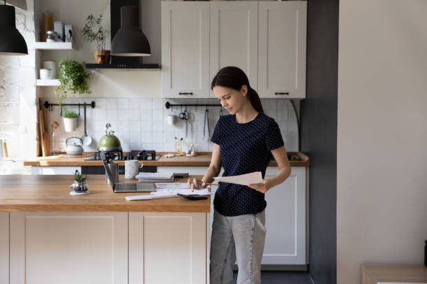 istock Young woman manage family budget pay bills using e-bank application 1397993257