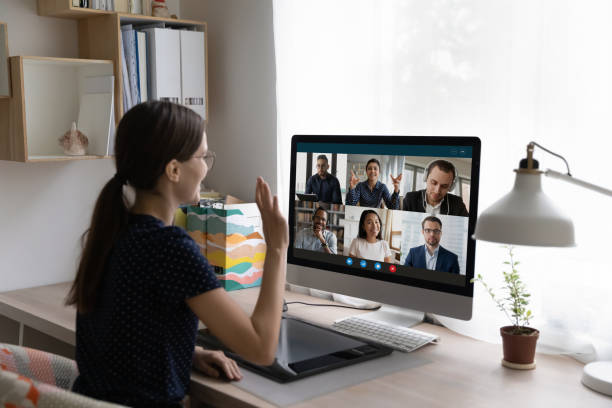 istock Woman greeting diverse friends, start group video call 1397993284