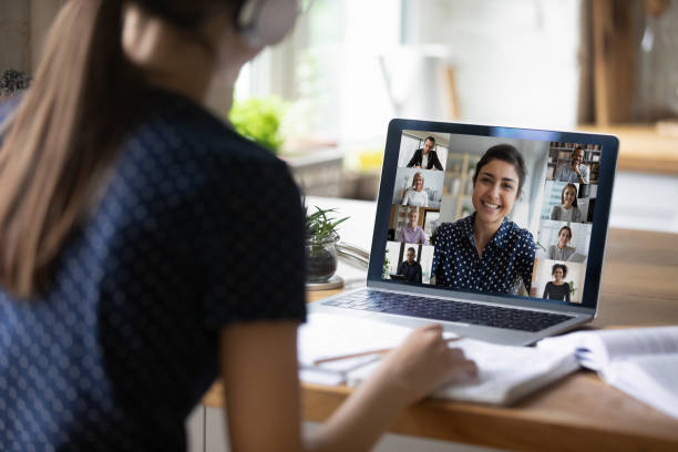 istock Indian teacher helps with assignment to student girl through videocall 1397993285