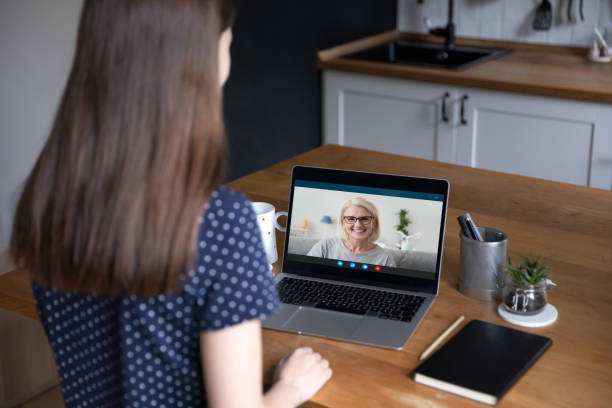 istock Middle-aged woman have conversation through videoconference to young woman 1397993292