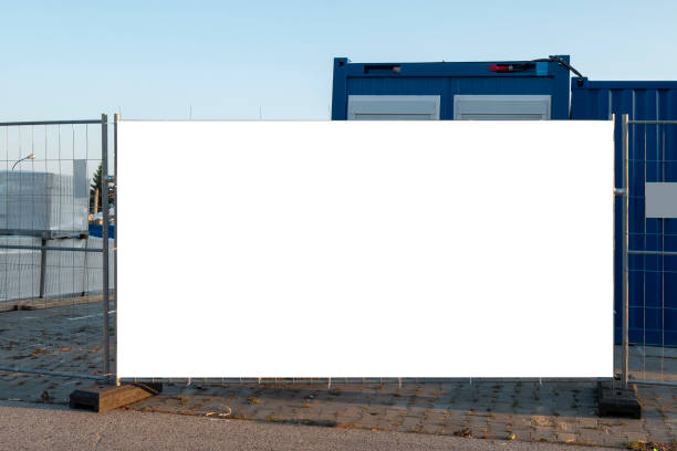 istock Blank white banner for advertisement on the fence of construction site 1397994995