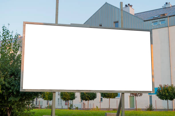 istock Advertosing billboard mock-up in front of modern apartment buildings 1397995096