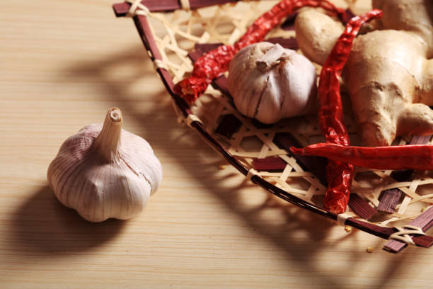 Ginger, garlic and red pepper in the bamboo basket, Studio shooting