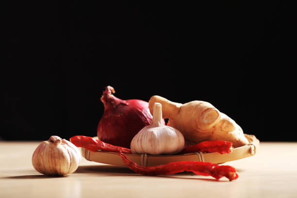Ginger, garlic and red pepper in the bamboo basket, Studio shooting