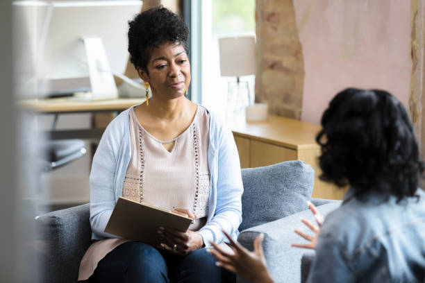 istock Therapist focuses on her patient 1398008734