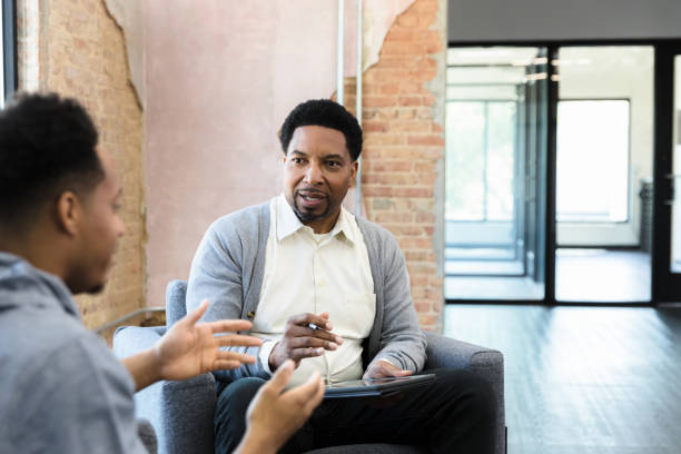 istock Therapist listens intently to his client 1398008753