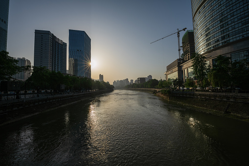 Sunrise Chengdu riverside modern urban buildings and bridges