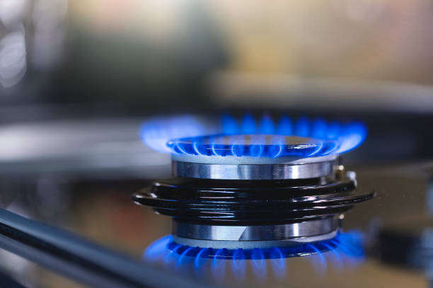 Natural gas blue flames Natural gas blue flames at kitchen gas stove burner stock pictures, royalty-free photos & images