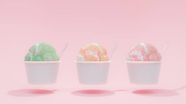 ピンク、オレンジ、ピンクの背景に白いカップにピンク、緑のパステルカラーのアイスクリーム。