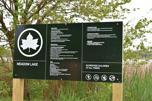 Flushing, Queens, New York, USA - May 14, 2022 - Welcome Sign to the Meadow Lake which is located in the Flushing Meadows Corona Park.