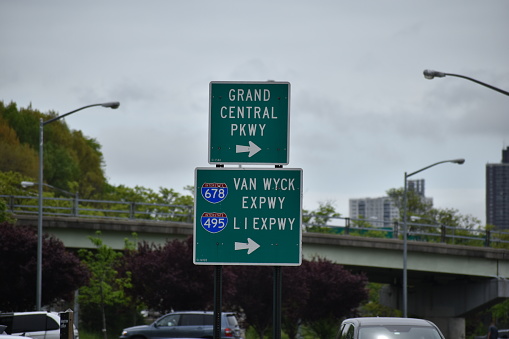 Flushing, Queens, New York, USA - May 14, 2022 - Directional Road Signs Showing Directions and Distances to the Grand Central Parkway, Van Wcyk Expressway and the LI Expressway.