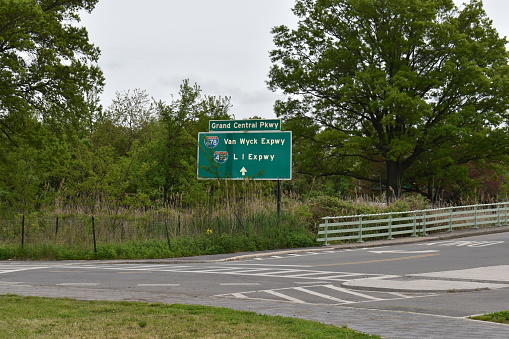 Flushing, Queens, New York, USA - May 14, 2022 - Directional Road Signs Showing Directions and Distances to the Grand Central Parkway, Van Wcyk Expressway and the LI Expressway.