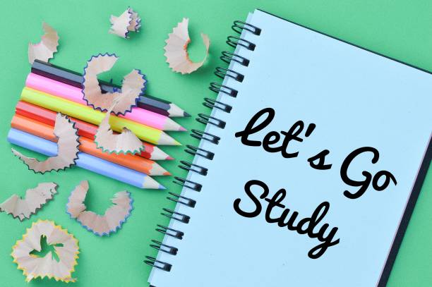 Notebook written with text LET'S GO STUDY Notebook written with text LET'S GO STUDY flaglets stock pictures, royalty-free photos & images