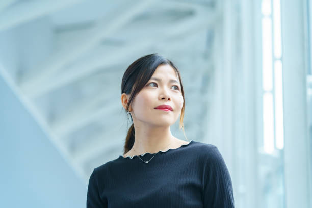 istock A woman standing in a business district 1398015103