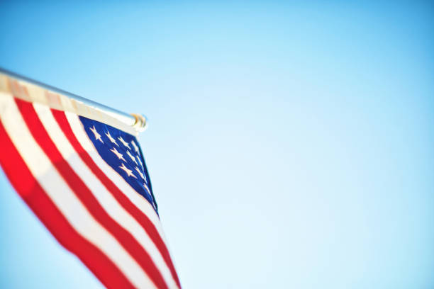 istock Memorial Day background with American flag with blue sky and space for text 1398016189