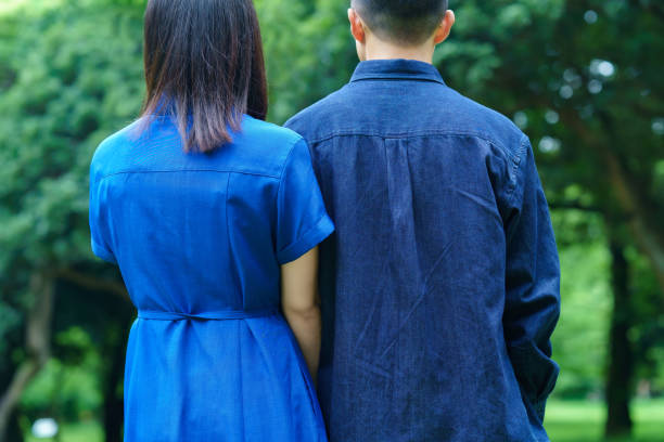 istock Back view of a young couple taking a walk 1398016270