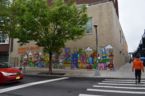 Queens, New York, USA - May 14, 2022 - Beautifully Painted Graffiti on the walls of the Marino P. Jeantet School in Corona.