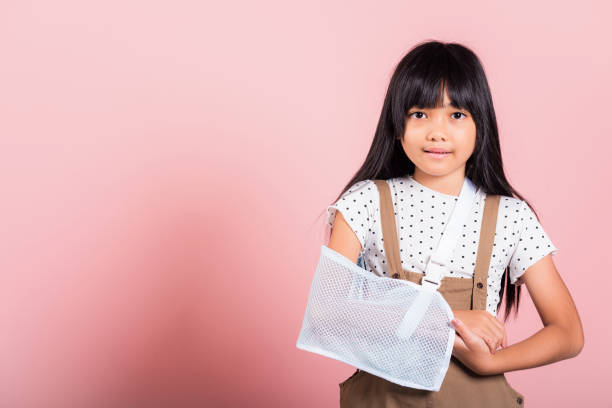 istock Asian little kid 10 years old hand bone broken from accident with arm splint 1398021518