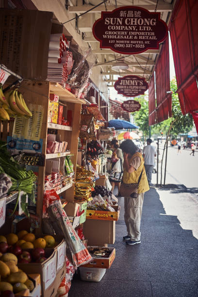 Oahu, Hawaii - July 19, 2011 : Outdoors view of people in a food market at the historic Chinatown