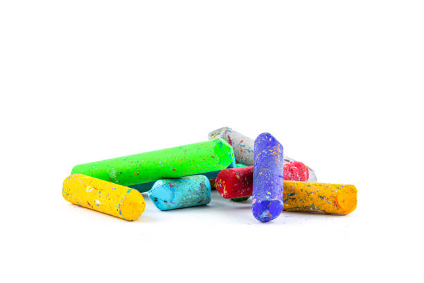 istock Used color crayons isolated on white background. 1398030420