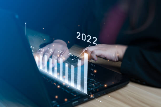 istock Business growth and progress concept. Businessman is showing virtual hologram chart from tablet. plans to increase business growth and an increase in the indicators of positive growth in 2022 1398031050