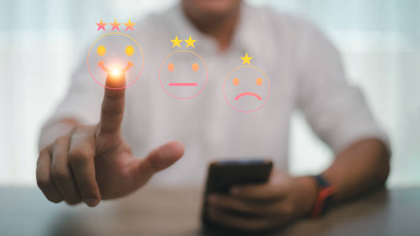istock Businessman pressing smiley face emoticon on virtual touch screen. Customer service evaluation concept. 1398033720