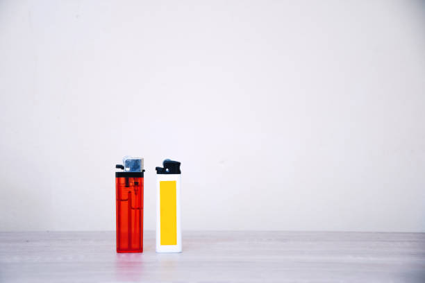 istock Gas lighter on a wooden table on a white background 1398034644