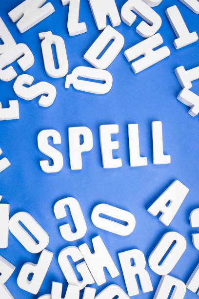 Spell word written in single white letters on a blue background with other single letters around it.