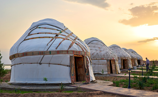 old asian yurts at sunset