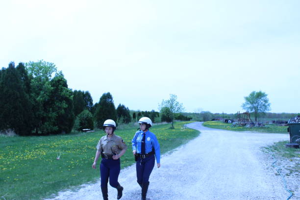 istock two Female police officers, blue uniform 1398039245
