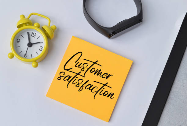 istock Top view of memo note written with text CUSTOMER SATISFACTION. 1398042758