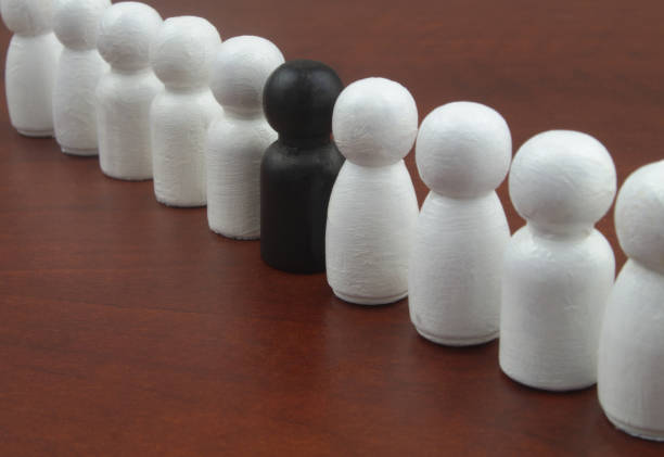 Brown and off white beige king chess pieces together, over black background for concepts power coalition, business Strategy and tactics, companionship, support, confrontation, leadership. Depth of field in object photography. The wooden chess pieces are brown and beige in color and have a textured effect of wood grain. The chess board is chequered in cream and brown colors.