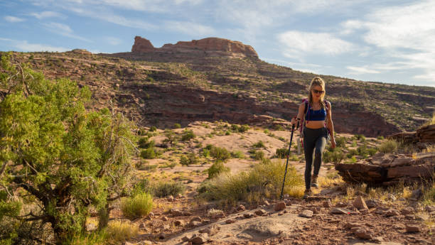 Hiker woman with backpack in the Utah desert