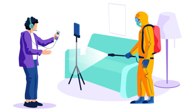 Man from epidemiological service doing disinfection at recording studio to kill viruses and bacteria The guy records a video about how man from epidemiological service wearing protective suit doing disinfection at recording studio to kill viruses and bacteria, sprays a room with disinfectant solute. office fogging stock illustrations