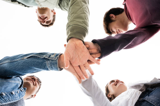 istock Group of friends giving high five 1398045003