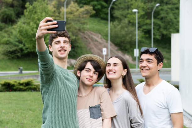 istock Group of teenagers taking a selfie 1398045006