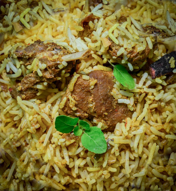 istock Delicious mutton biryani top view.Biryani rice dish Beautiful Indian rice dish.Delicious spicy chicken biryani in bowl over moody background, it’s a popular Indian and Pakistani food. 1398046255